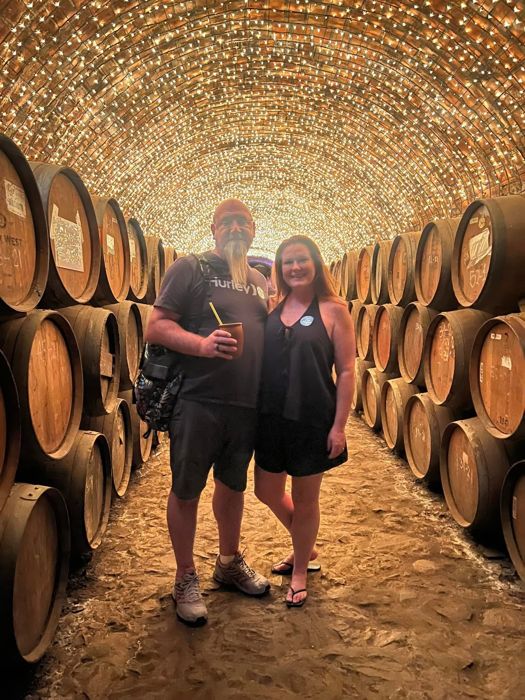 Guests in a candlelit tequila barrel cellar