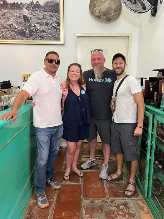Group of friends smiling inside a local shop