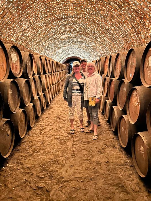 Two guests in a barrel-lined tunnel