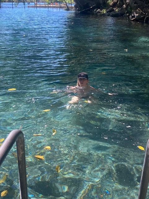 Swimmer in clear spring water