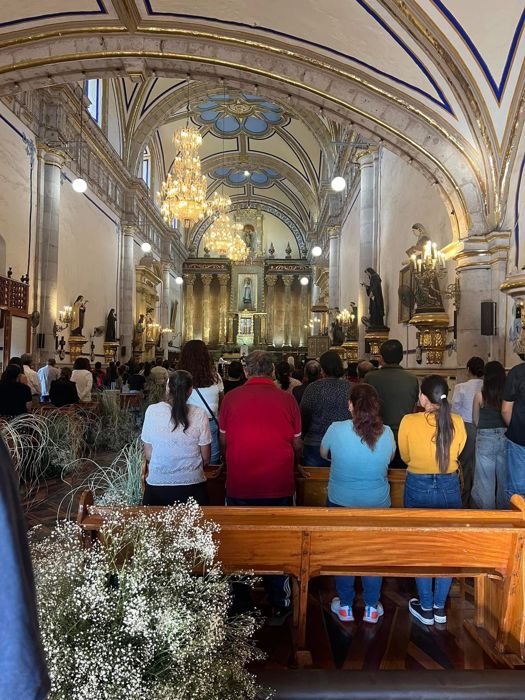 Visitors inside an ornate church