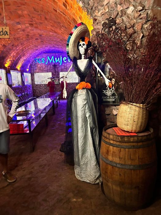 Day of the Dead figure in a decorated cellar